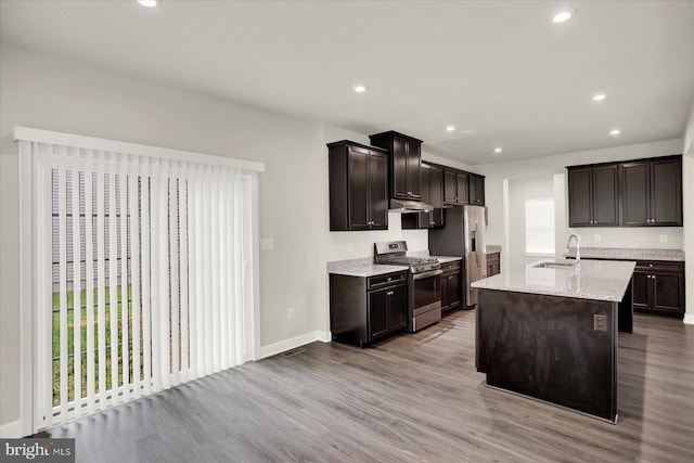 2005 Benjamin Ct, Harrisburg, PA 17110 - kitchen with stainless steel appliances, under cabinet range hood, light wood-style floors, recessed lighting, and dark brown cabinets