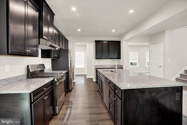 2005 Benjamin Ct, Harrisburg, PA 17110 - kitchen featuring appliances with stainless steel finishes, under cabinet range hood, a spacious island, dark wood finished floors, and light stone countertops