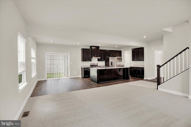 2005 Benjamin Ct, Harrisburg, PA 17110 - kitchen featuring open floor plan, stainless steel fridge, a kitchen island with sink, light countertops, and dark carpet