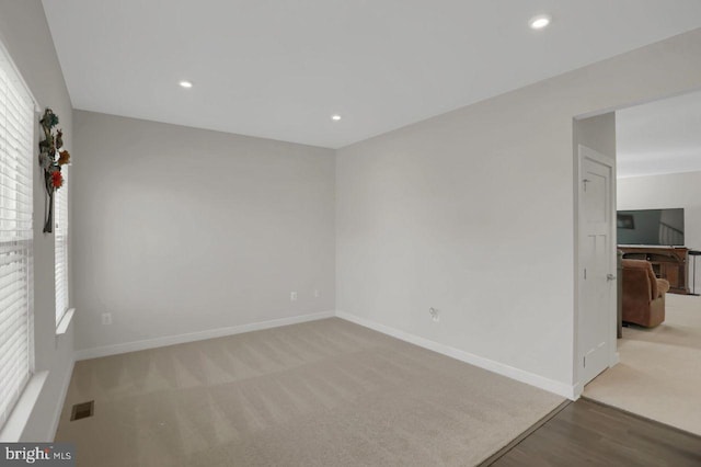 2005 Benjamin Ct, Harrisburg, PA 17110 - unfurnished room with carpet floors, recessed lighting, and wood finished floors