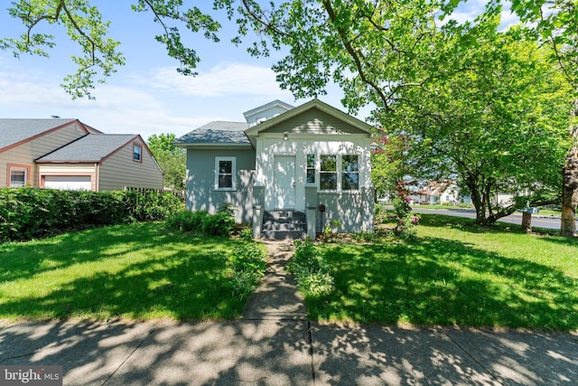 503 W Park Ave, Hamilton, NJ 08610 - bungalow featuring a front lawn, a shingled roof, and stucco siding