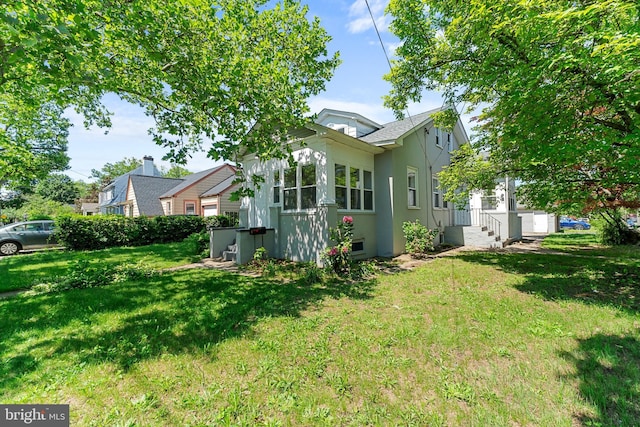 503 W Park Ave, Hamilton, NJ 08610 - view of property exterior with a yard and stucco siding
