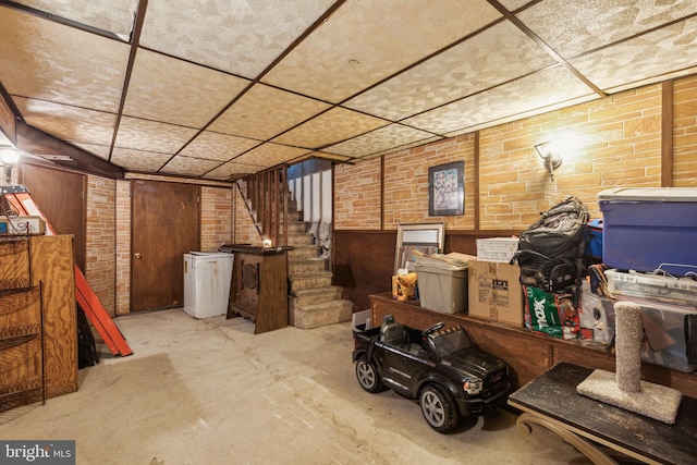 3164 Cedar St, Philadelphia, PA 19134 - finished basement with stairs, brick wall, and wood walls