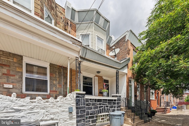 3164 Cedar St, Philadelphia, PA 19134 - entrance to property with covered porch and stone siding