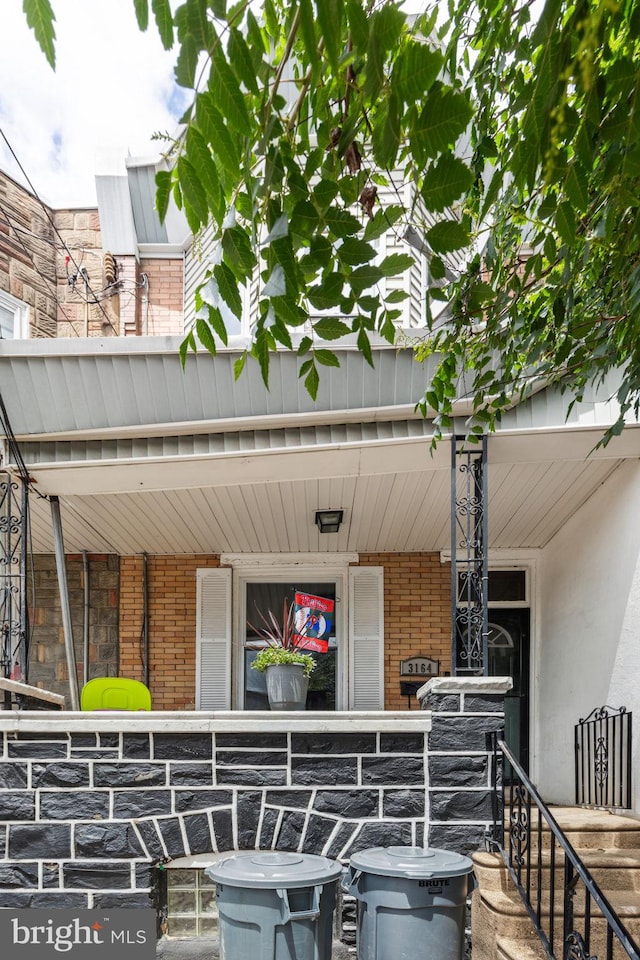 3164 Cedar St, Philadelphia, PA 19134 - view of exterior entry with brick siding and a porch