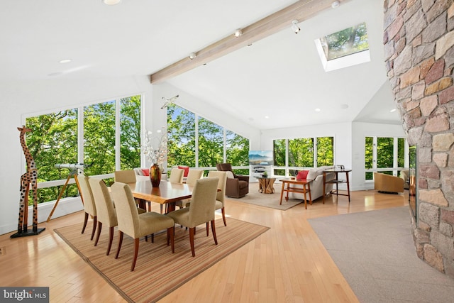 511 Center Hl, Upper Black Eddy, PA 18972 - dining space with beam ceiling, a skylight, light wood-type flooring, plenty of natural light, and high vaulted ceiling