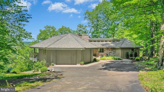 511 Center Hl, Upper Black Eddy, PA 18972 - view of front of home with a chimney, asphalt driveway, and stone siding