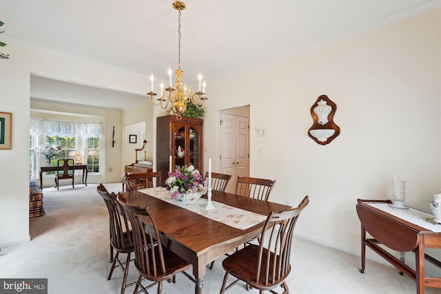 19655 Smith Cir, Ashburn, VA 20147 - dining space featuring light carpet, a chandelier, crown molding, and baseboards
