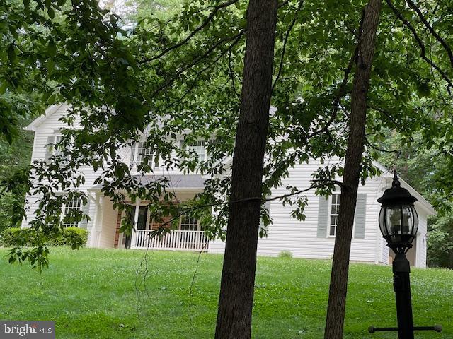 6051 Whippoorwill Dr, Warrenton, VA 20187 - view of property exterior featuring a yard