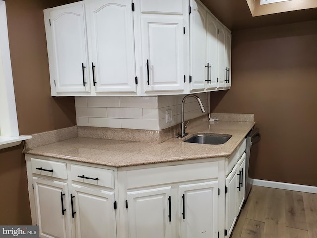 115 Kings Hwy Unit # 196, Maple Shade, NJ 08052 - kitchen with a sink, light wood-type flooring, decorative backsplash, white cabinetry, and baseboards