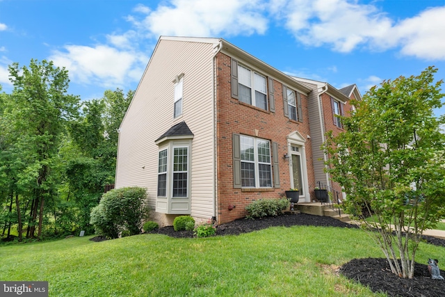 7424 Serenade Cir, Clinton, MD 20735 - view of property exterior with brick siding and a yard