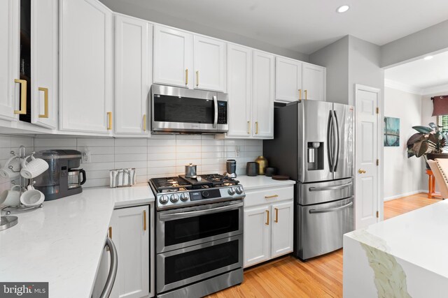 7424 Serenade Cir, Clinton, MD 20735 - kitchen featuring stainless steel appliances, light wood-style flooring, white cabinets, recessed lighting, and crown molding