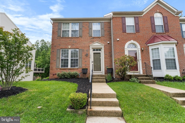 7424 Serenade Cir, Clinton, MD 20735 - view of property featuring a front yard and brick siding
