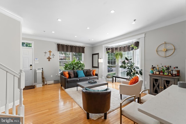 7424 Serenade Cir, Clinton, MD 20735 - living area with light wood-style flooring, crown molding, recessed lighting, baseboards, and stairway