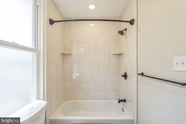 full bath featuring tub / shower combination, toilet, and recessed lighting