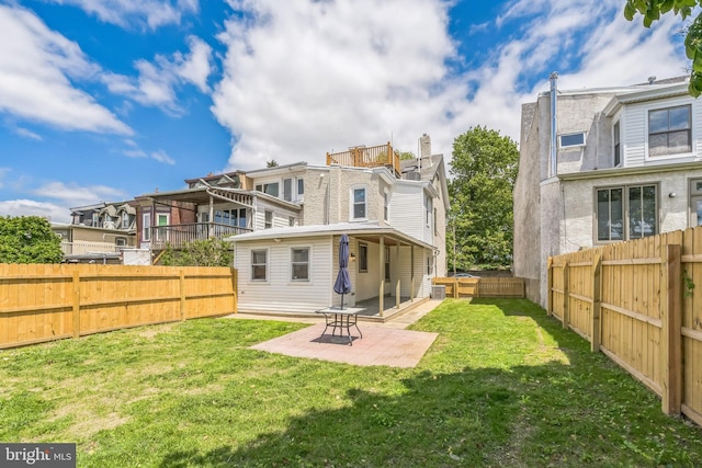 back of house with a patio