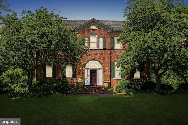 501 Stone Chapel Rd, Westminster, MD 21157 - georgian-style home featuring a front yard and brick siding