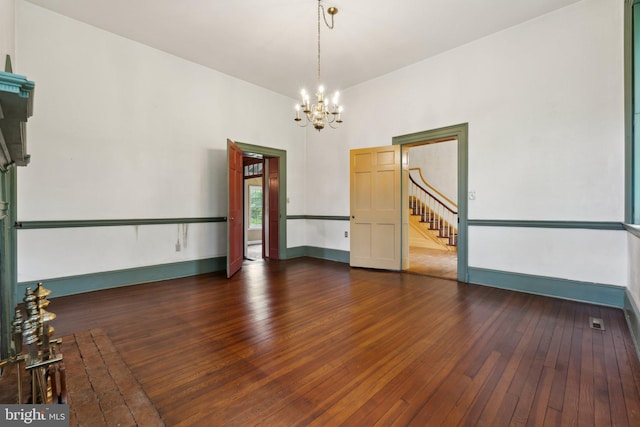 501 Stone Chapel Rd, Westminster, MD 21157 - unfurnished room with a chandelier, hardwood / wood-style floors, stairs, and baseboards