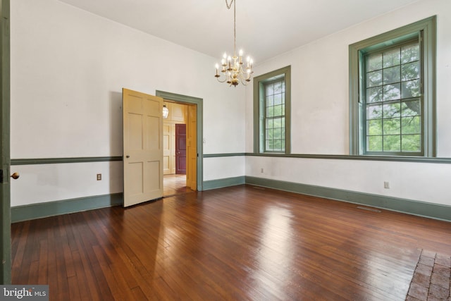501 Stone Chapel Rd, Westminster, MD 21157 - spare room featuring a chandelier, hardwood / wood-style floors, and baseboards
