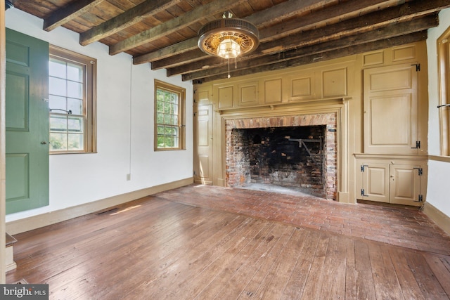 501 Stone Chapel Rd, Westminster, MD 21157 - unfurnished living room with wood ceiling with exposed beams, hardwood / wood-style floors, baseboards, and plenty of natural light