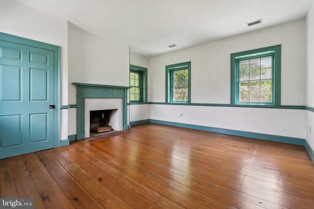 501 Stone Chapel Rd, Westminster, MD 21157 - unfurnished living room with a fireplace, hardwood / wood-style flooring, and baseboards