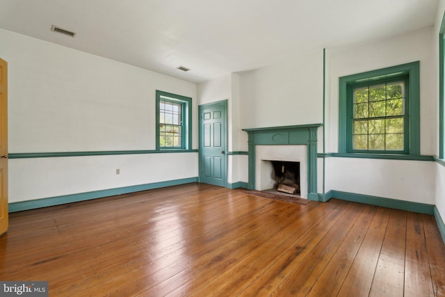 501 Stone Chapel Rd, Westminster, MD 21157 - unfurnished living room with a premium fireplace, wood-type flooring, and baseboards