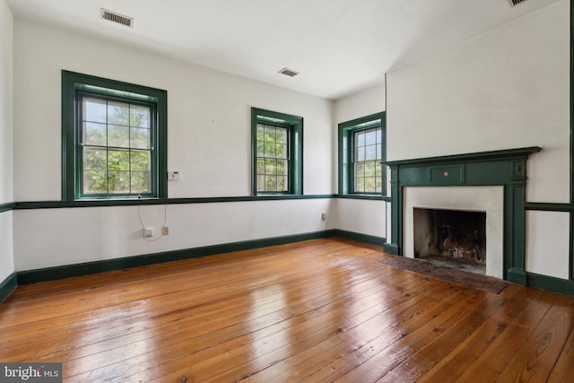 501 Stone Chapel Rd, Westminster, MD 21157 - unfurnished living room with wood-type flooring, a fireplace with flush hearth, and baseboards