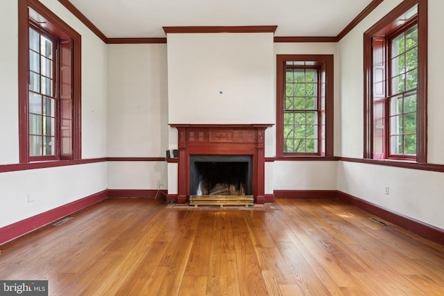 501 Stone Chapel Rd, Westminster, MD 21157 - unfurnished living room featuring hardwood / wood-style floors, a fireplace with flush hearth, baseboards, and crown molding