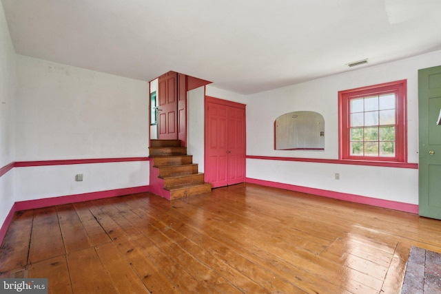 501 Stone Chapel Rd, Westminster, MD 21157 - unfurnished room with wood-type flooring, stairway, and baseboards