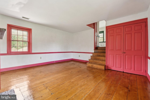 501 Stone Chapel Rd, Westminster, MD 21157 - empty room featuring wood-type flooring, stairway, and baseboards