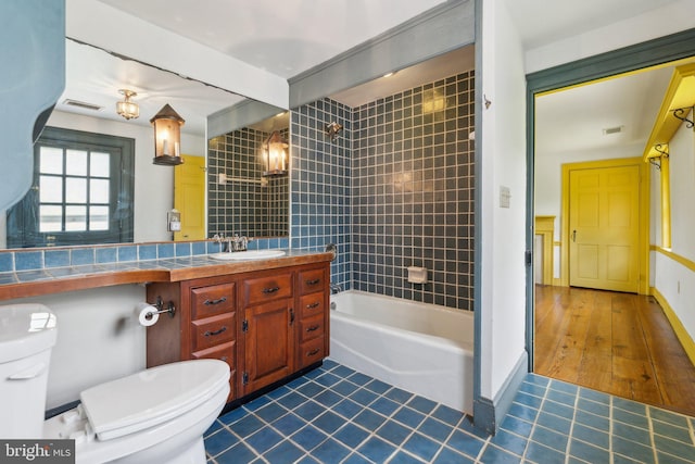 501 Stone Chapel Rd, Westminster, MD 21157 - full bath featuring toilet, vanity, tile patterned flooring, and bathtub / shower combination