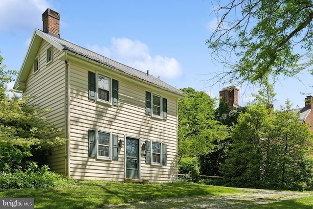 501 Stone Chapel Rd, Westminster, MD 21157 - rear view of property featuring metal roof, a yard, and a chimney