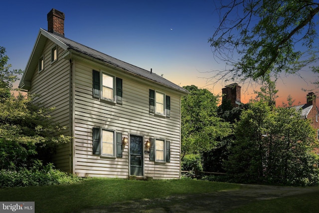501 Stone Chapel Rd, Westminster, MD 21157 - view of front of house with metal roof, a chimney, and a yard