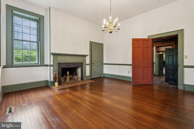 501 Stone Chapel Rd, Westminster, MD 21157 - unfurnished living room with a chandelier, dark wood-style floors, a premium fireplace, a high ceiling, and baseboards