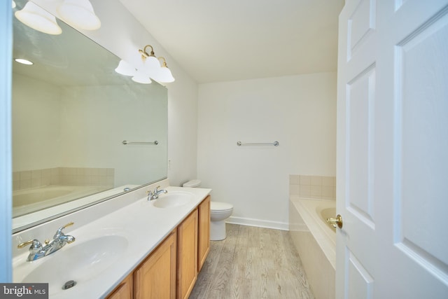 33 Owens Landing Ct Unit 33C, Perryville, MD 21903 - full bathroom with a garden tub, wood finished floors, toilet, double vanity, and baseboards