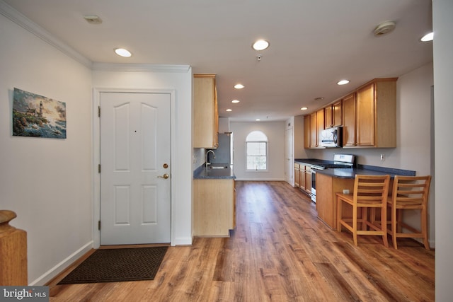 33 Owens Landing Ct Unit 33C, Perryville, MD 21903 - kitchen with appliances with stainless steel finishes, dark countertops, baseboards, recessed lighting, and light wood-style flooring