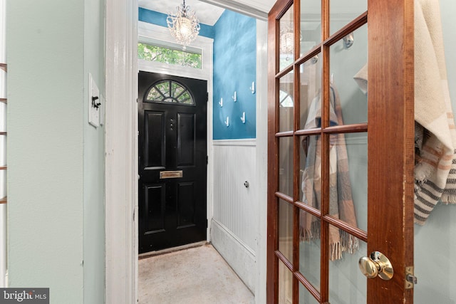 836 N 25th St, Philadelphia, PA 19130 - foyer entrance featuring a wainscoted wall and a chandelier