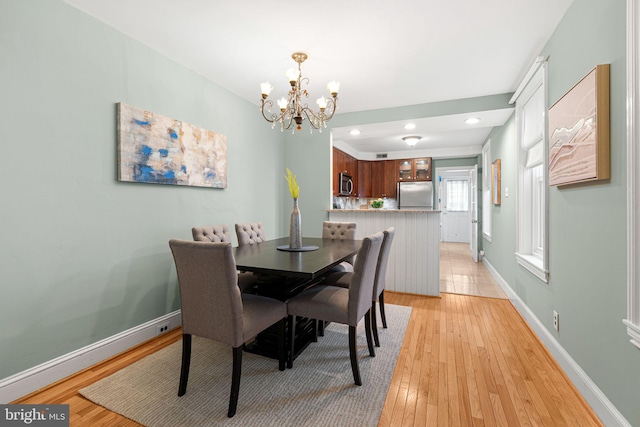 836 N 25th St, Philadelphia, PA 19130 - dining area featuring a chandelier, light wood-style flooring, recessed lighting, and baseboards