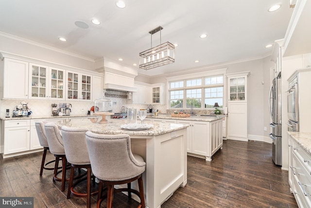 12 Sagecrest Cir, Enola, PA 17025 - kitchen with a center island, white cabinetry, backsplash, crown molding, and recessed lighting