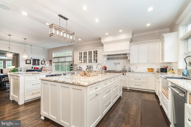 12 Sagecrest Cir, Enola, PA 17025 - kitchen with ornamental molding, appliances with stainless steel finishes, a center island with sink, a sink, and white cabinetry