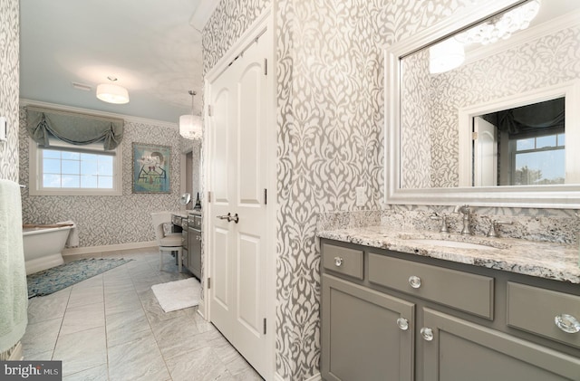 12 Sagecrest Cir, Enola, PA 17025 - bathroom with wallpapered walls, ornamental molding, vanity, a freestanding tub, and baseboards