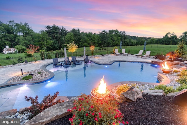 12 Sagecrest Cir, Enola, PA 17025 - pool at dusk with a fire pit, a patio, and view of scattered trees