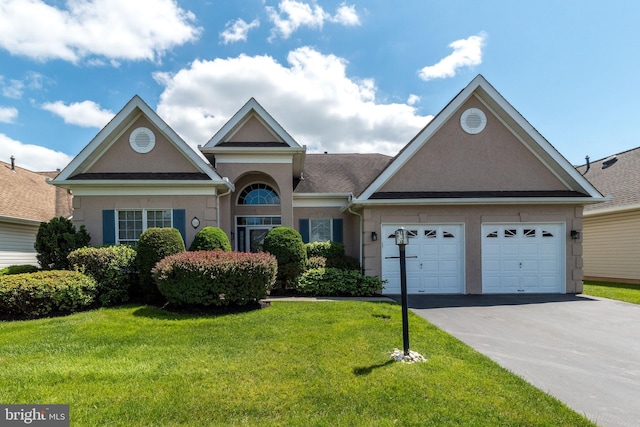 39 Nathaniel, Holland, PA 18966 - view of front of house featuring stucco siding, concrete driveway, a front yard, and an attached garage