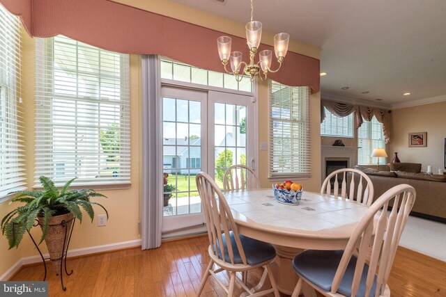 39 Nathaniel, Holland, PA 18966 - dining room featuring light wood-style flooring, plenty of natural light, a chandelier, and crown molding