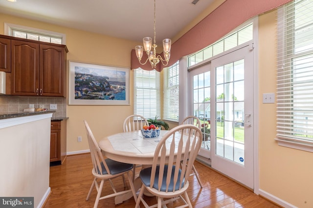 39 Nathaniel, Holland, PA 18966 - dining room featuring a chandelier, light wood-type flooring, and baseboards