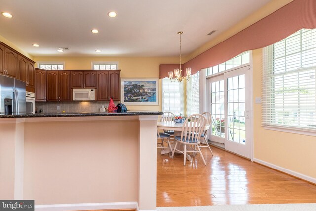 39 Nathaniel, Holland, PA 18966 - kitchen with white appliances, recessed lighting, healthy amount of natural light, a chandelier, and light wood finished floors