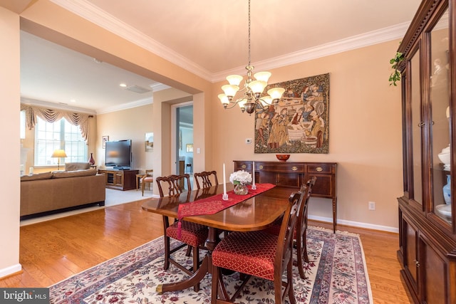 39 Nathaniel, Holland, PA 18966 - dining room with light wood-type flooring, a chandelier, crown molding, and baseboards