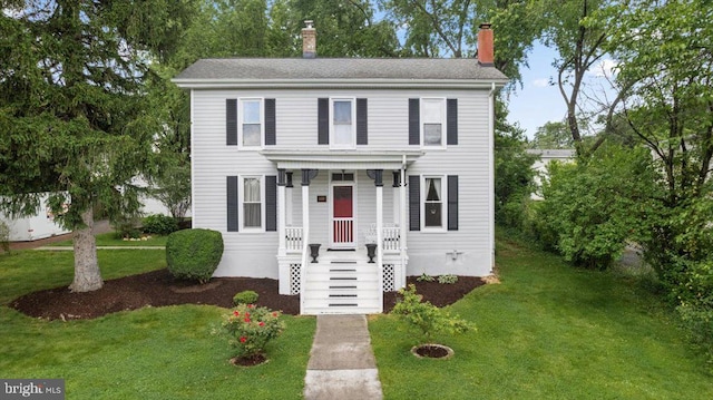 116 W 17th St, Front Royal, VA 22630 - view of front of home featuring a chimney, a front yard, and a shingled roof
