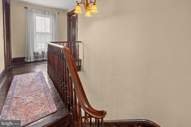 116 W 17th St, Front Royal, VA 22630 - staircase featuring a chandelier, wood finished floors, and baseboards