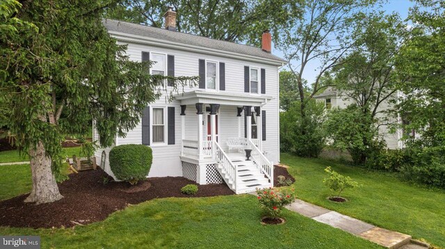 116 W 17th St, Front Royal, VA 22630 - view of front of home featuring a chimney, covered porch, and a front yard